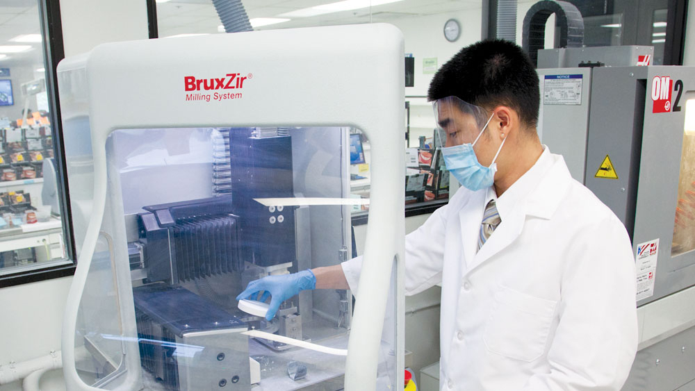 Restoration being fabricated in the milling machine